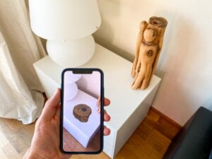 AR item on a table being viewed through a smartphone